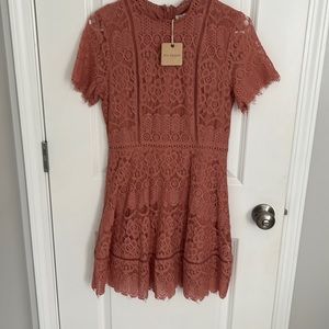 Beautiful brand new with tags on pink lace dress. Size Small